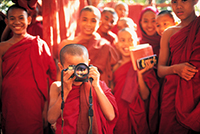 Monk with camera, Burma - TPOTY winner - TPOTY 2003