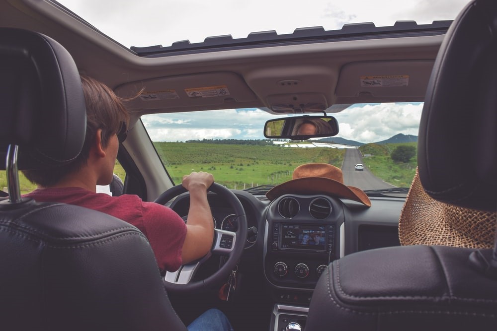 Man driving in a rental car